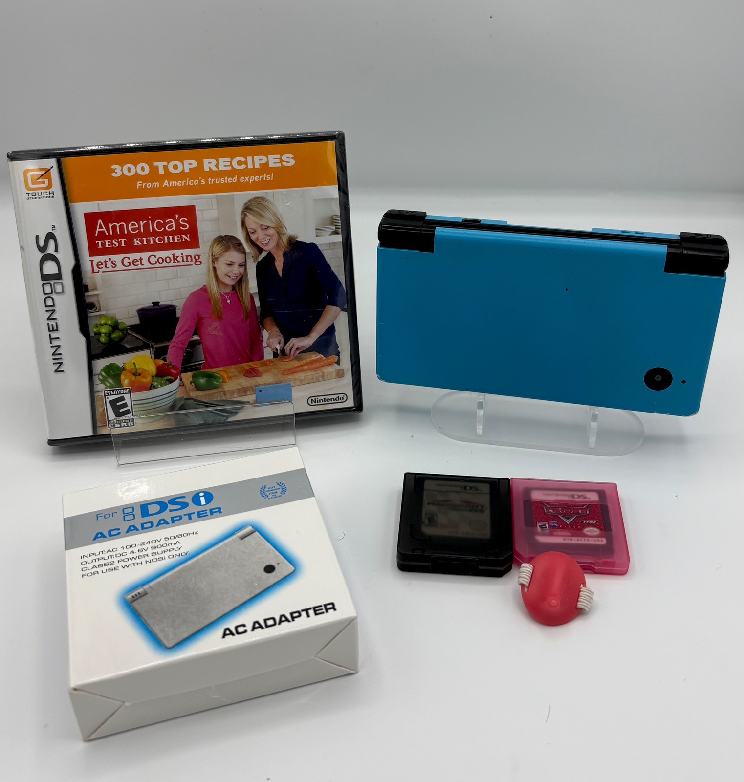 Nintendo DSi Blue Handheld Game Console with 3 Games Mario Kart & Ac Adapter