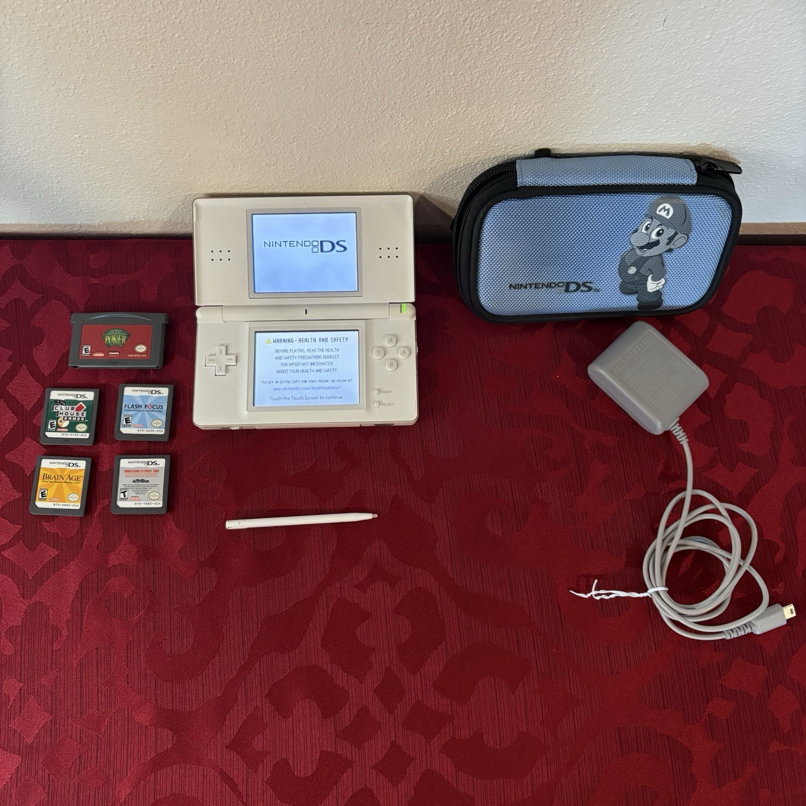 Tested Nintendo DS Lite w/ Case, Five Games, Aftermarket Charger, and Stylus