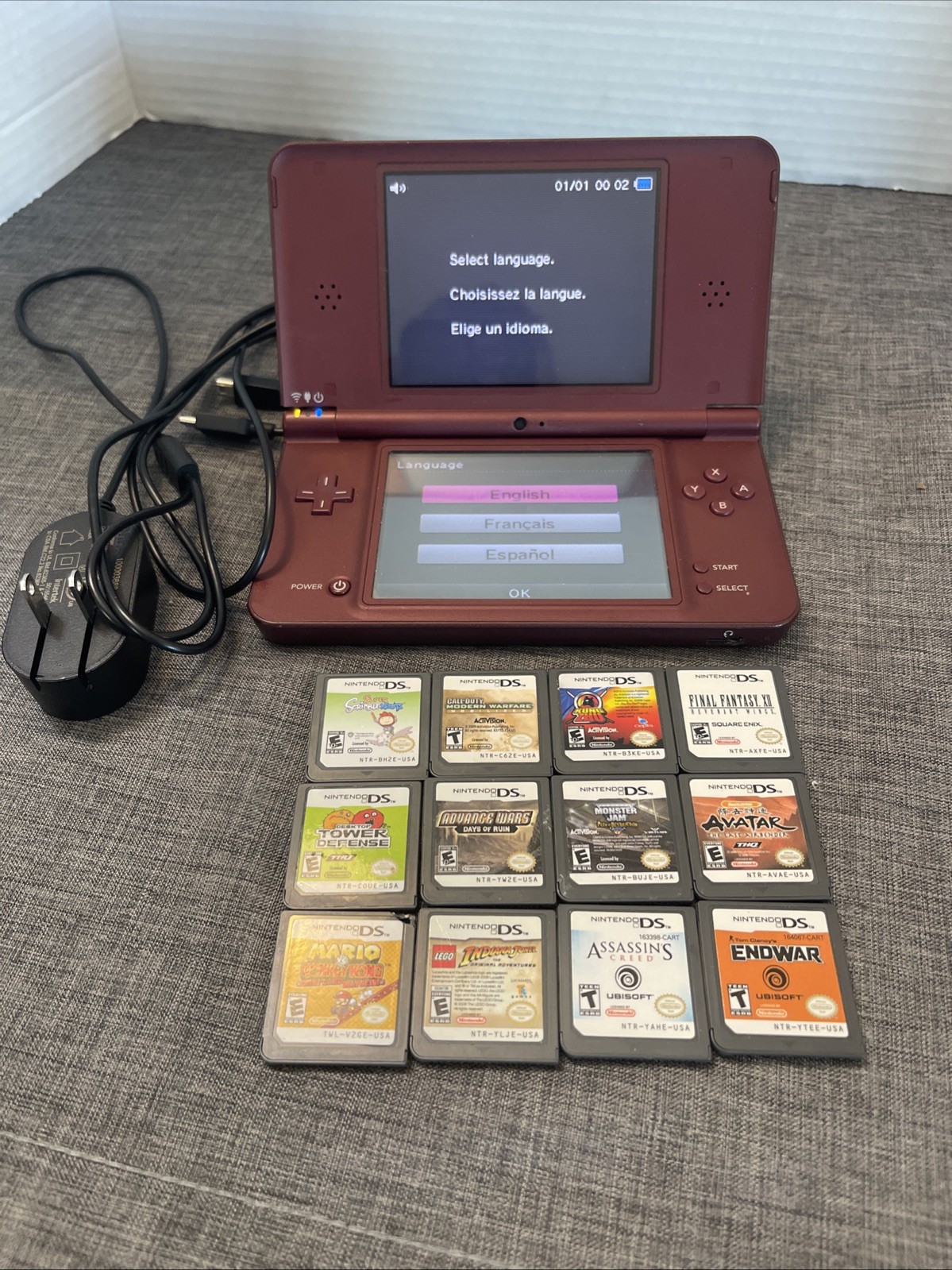 Nintendo DSi XL Console W/ charger+ 12 games. Clean NO STYLUS Works Great