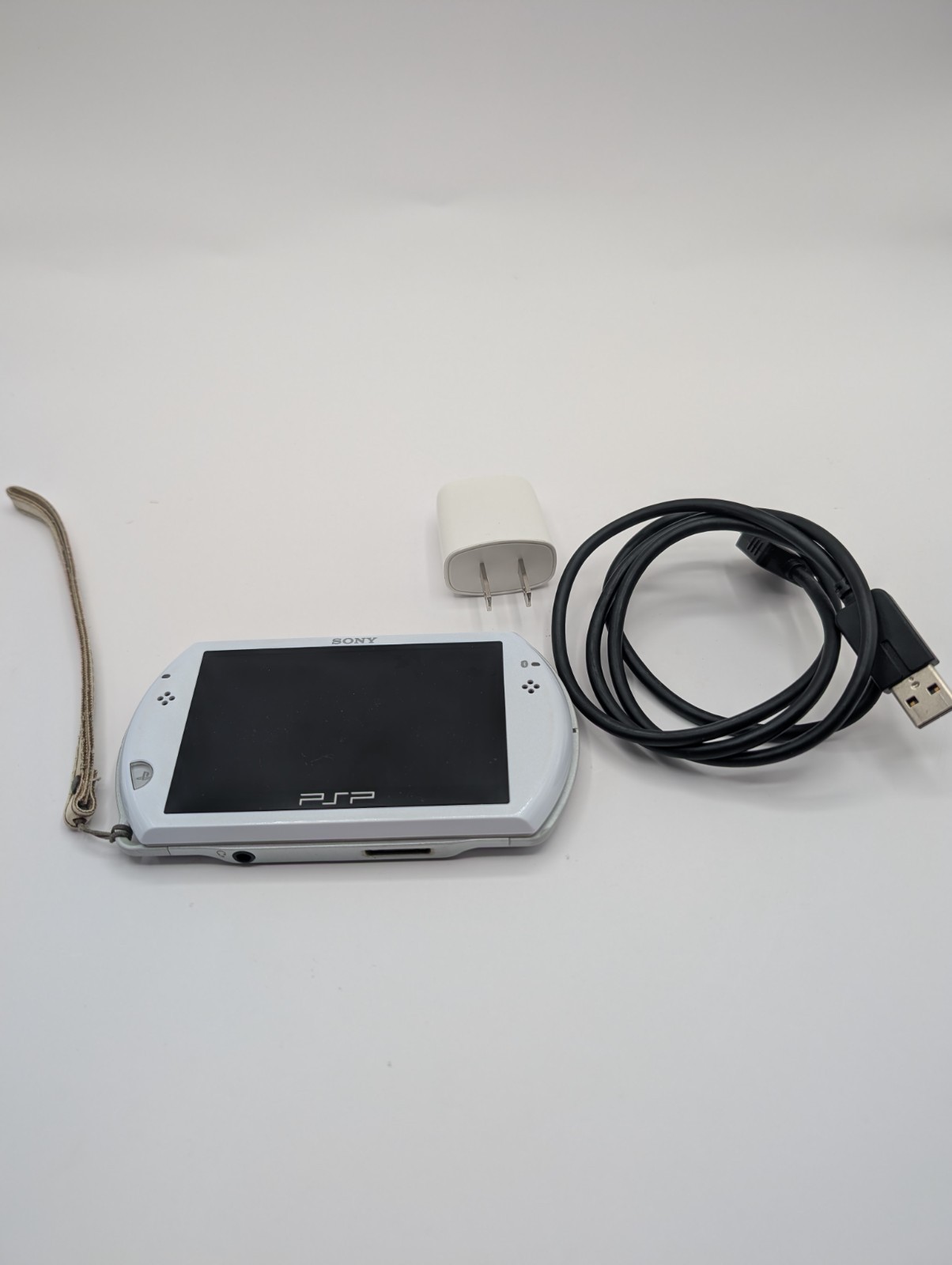 Sony PSP Playstation Portable Go N-1001 Console White with 12 GB memory card