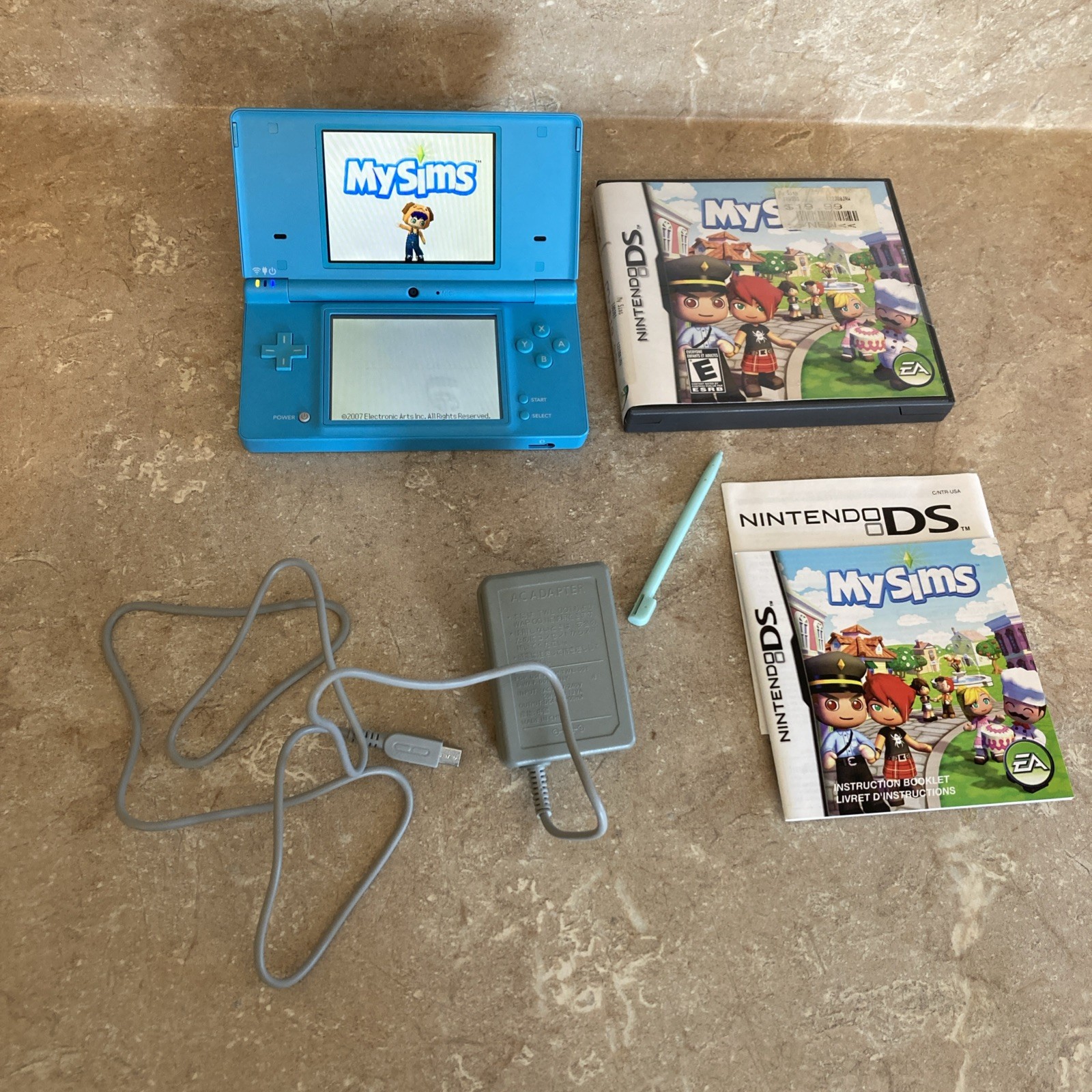 Nintendo DSi Light Blue Handheld Console Game System W/Sims Game Good Condition
