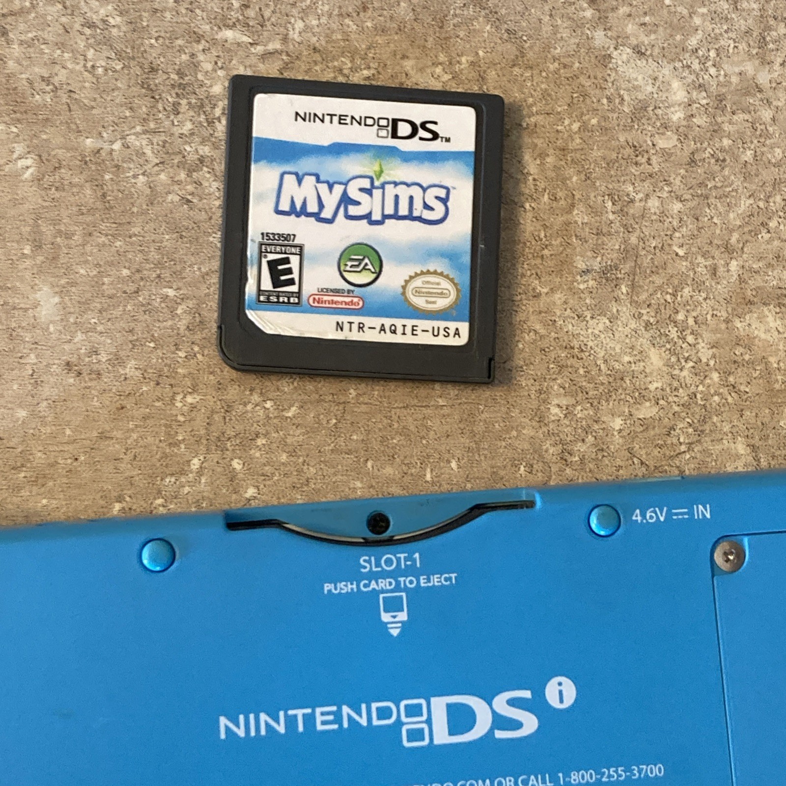 Nintendo DSi Light Blue Handheld Console Game System W/Sims Game Good Condition