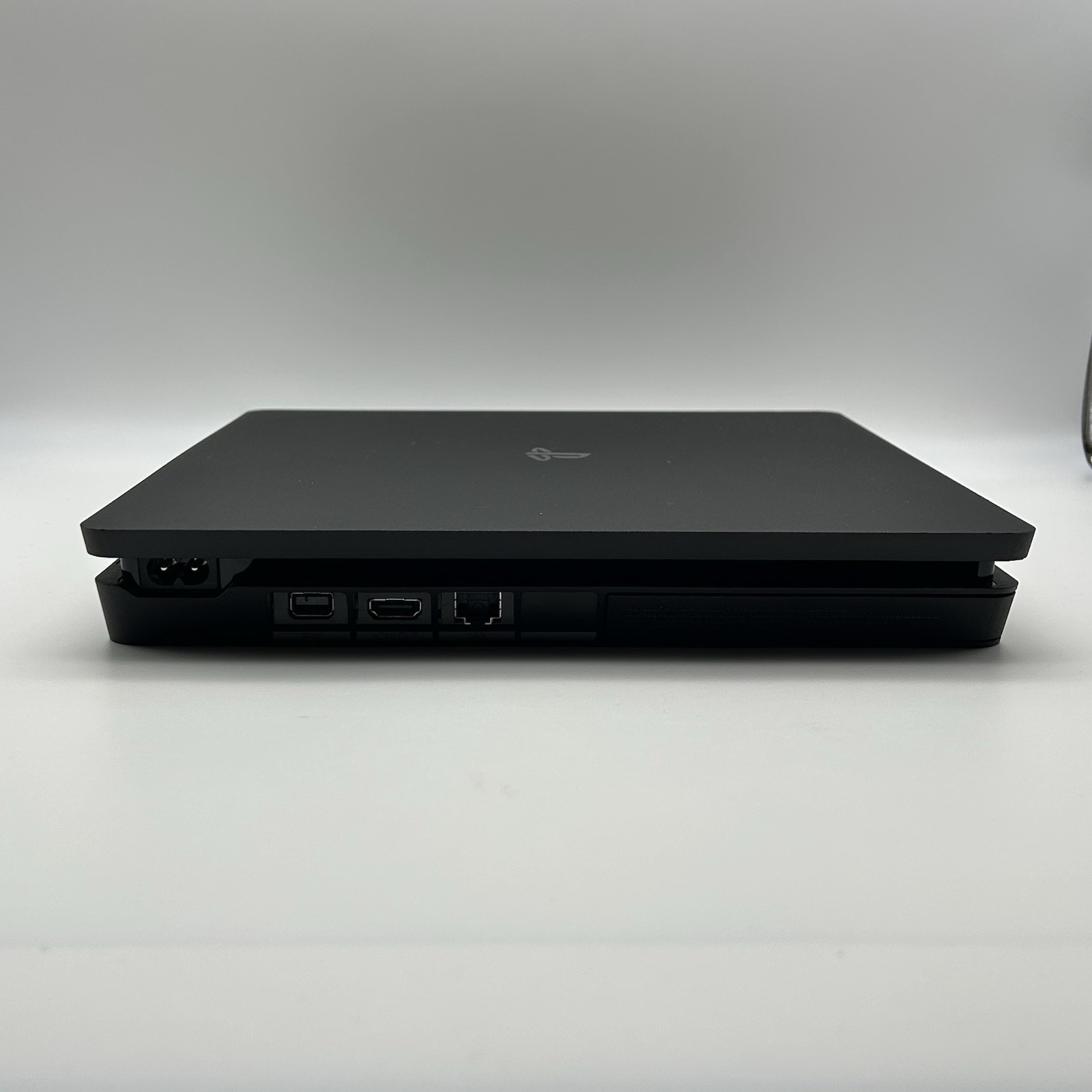 Sony PS4 Slim 1TB Console Bundle [Includes 2 Controllers, Power Cord, HDMI Cord]