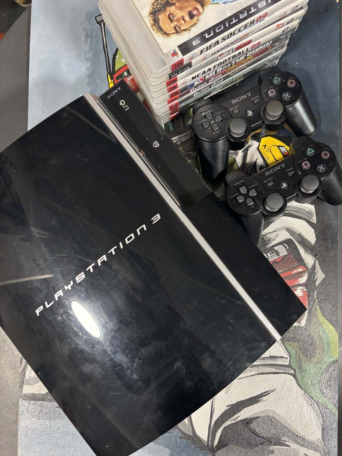 Sony PlayStation 3 W/ 2 Remotes And 10 Games Bundle