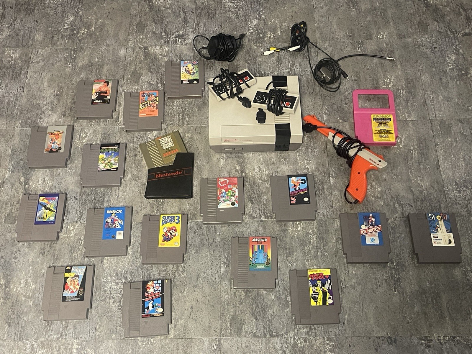 Original Nintendo NES bundle with cords, 2 controllers, zapper, and 17 games