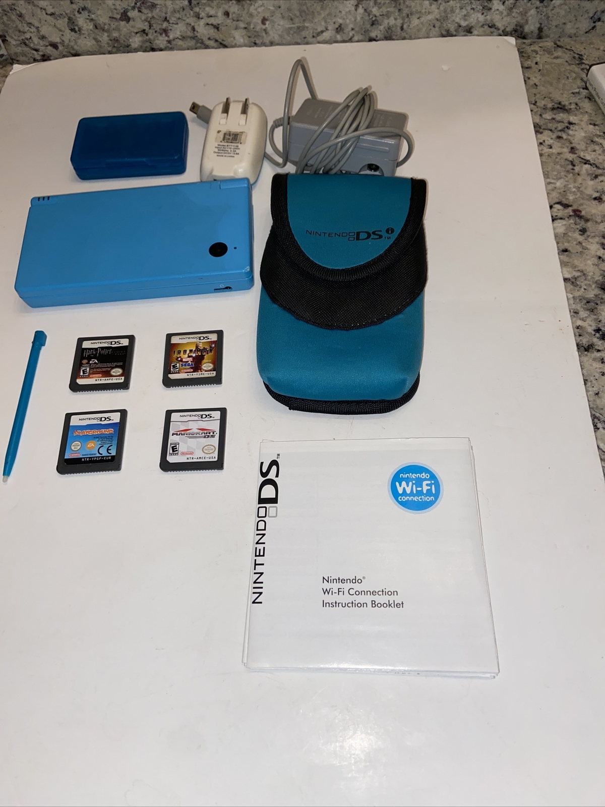 Nintendo DSi Handheld Game Console – Blue w/ 4 Games, Charger + Case + Stylus.