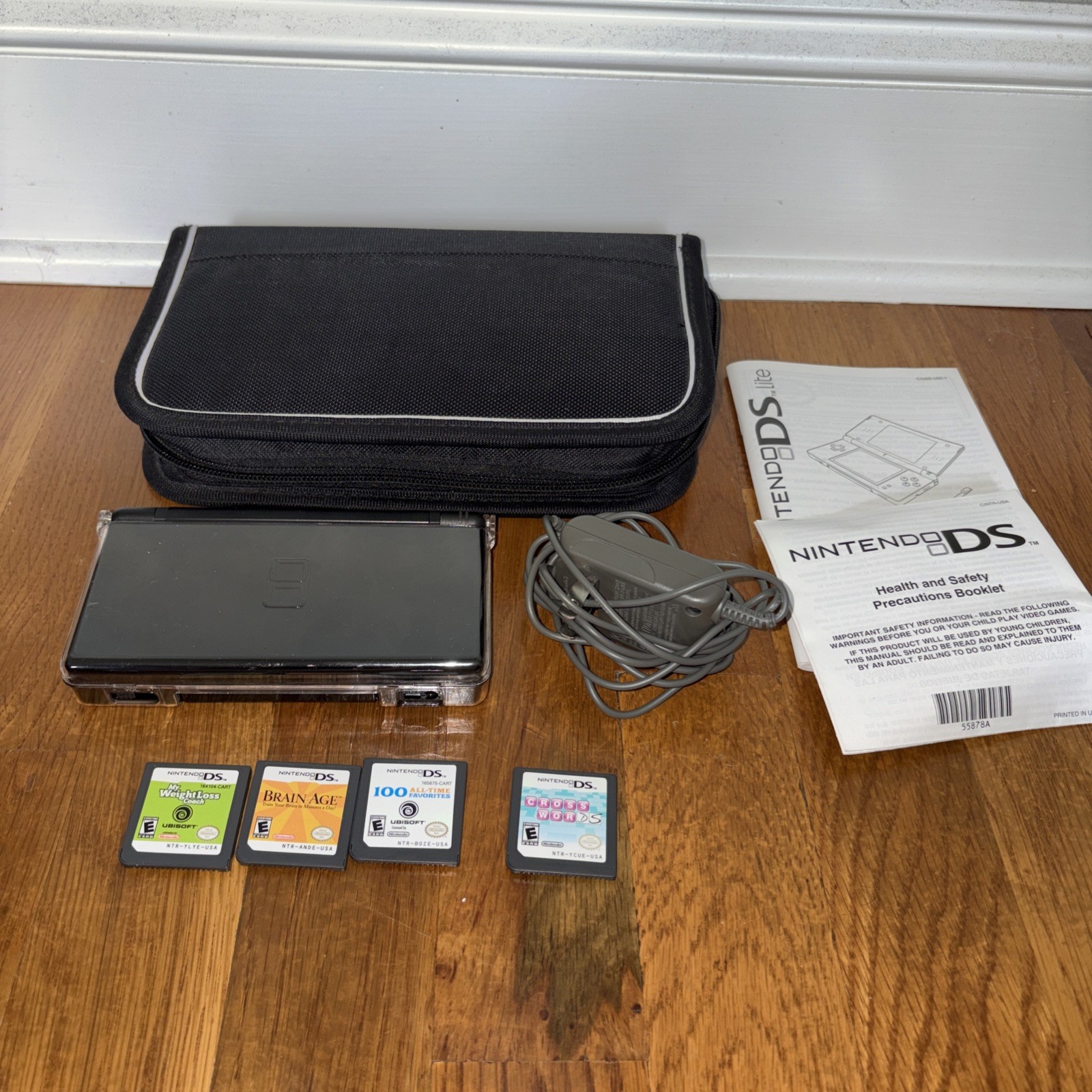 Nintendo DS Lite Console Black with charger case and four games model USG-001