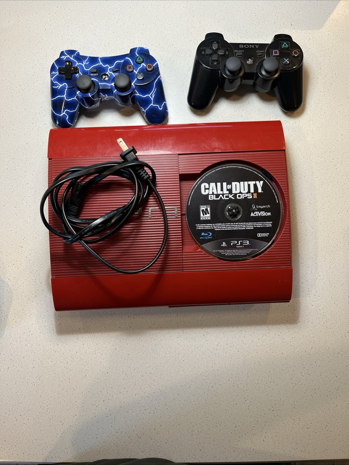 TESTED-WORKS. Sony PlayStation 3 PS3 Super Slim Red w/game controllers/cables