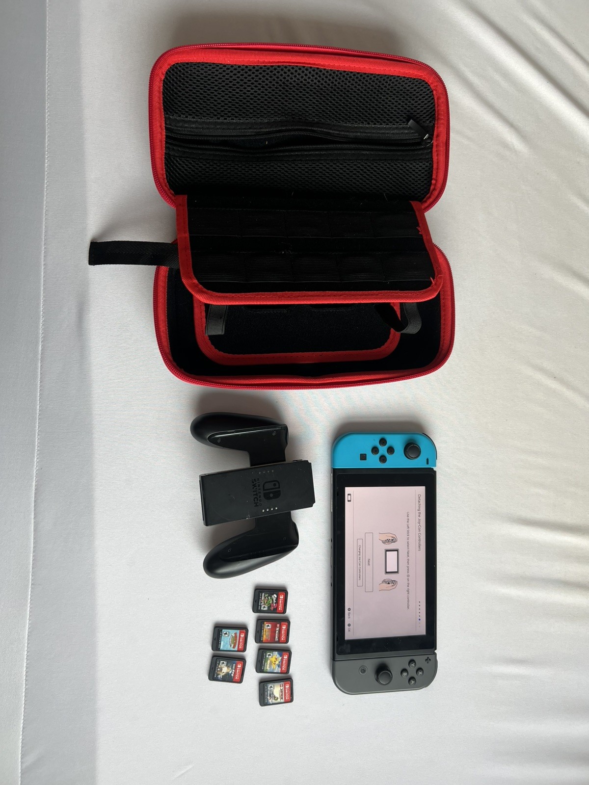 Nintendo Switch Grey/Blue Joycons with Hard Travel Case + 6 Games and Controller