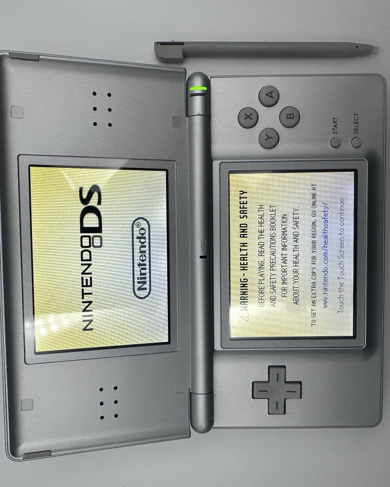 Nintendo DS Lite Silver Console w/ Stylus + Nicktoons Game (No Charger included)