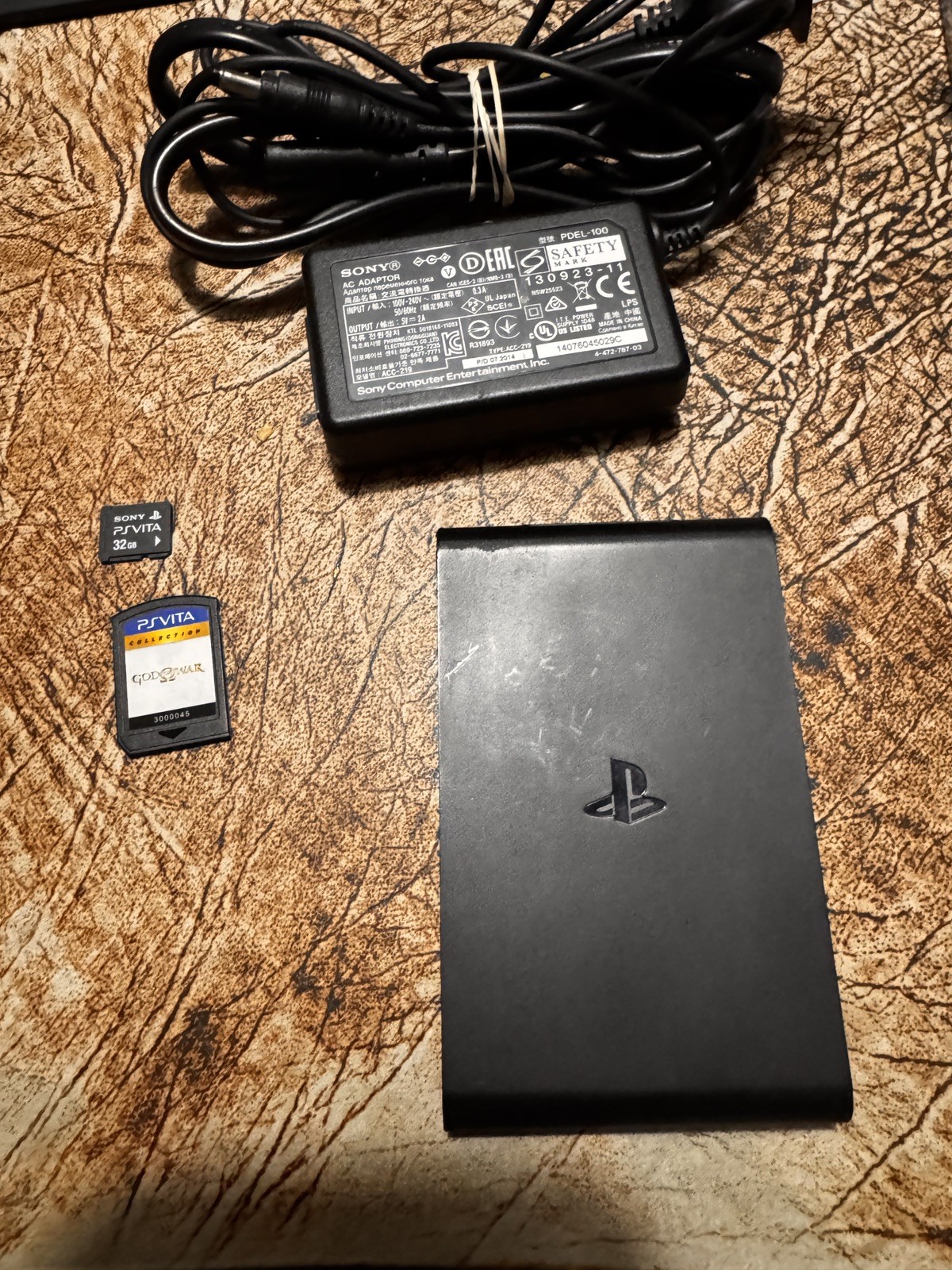 SONY PLAYSTATION TV CONSOLE VTE 1001 with 32gb memory, God Of War, and RE 1,2,3+