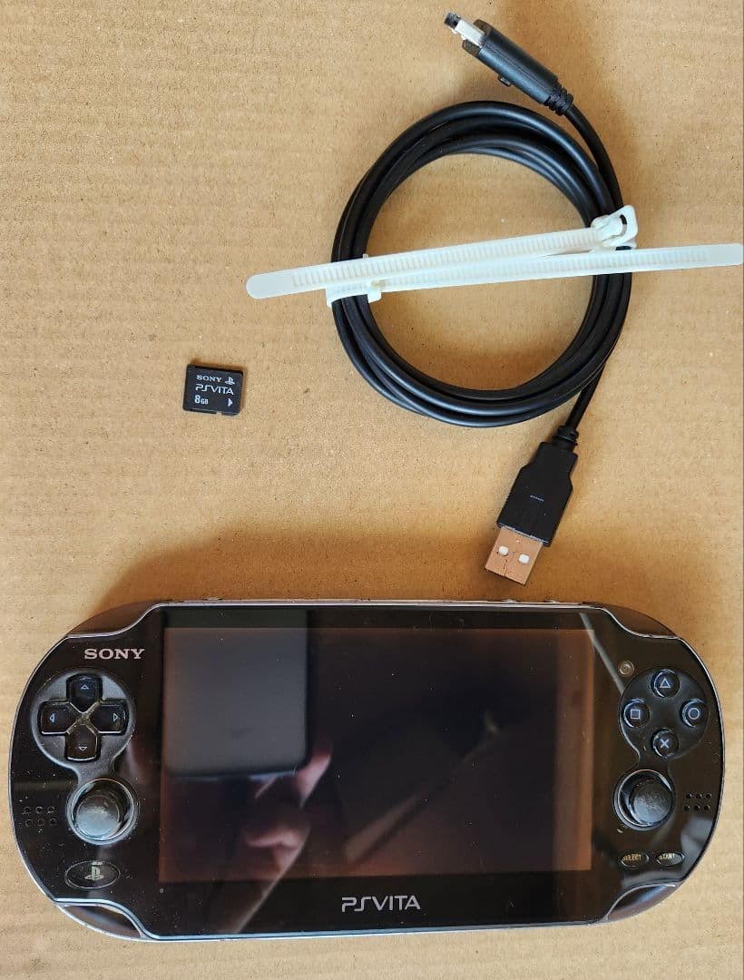 PSVita console PCH 1000 with 8GB memory card and USB charging cable